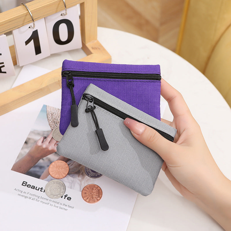 Mini porte-monnaie à fermeture éclair en tissu Oxford pour femmes, couleur unie